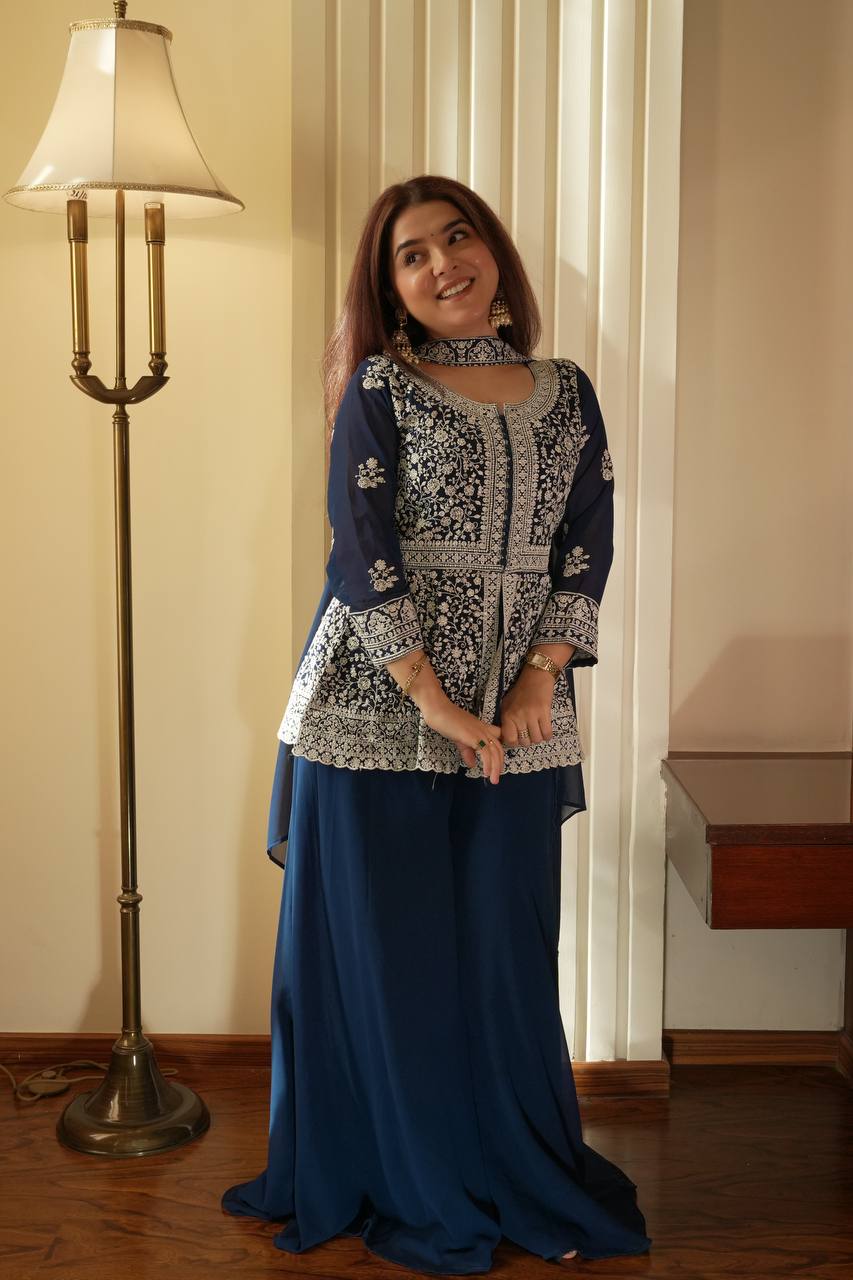 Based on this elegant navy blue embroidered ethnic outfit