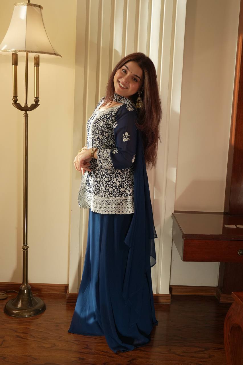 Based on this elegant navy blue embroidered ethnic outfit