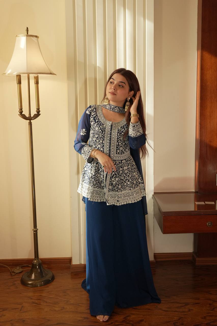 Based on this elegant navy blue embroidered ethnic outfit