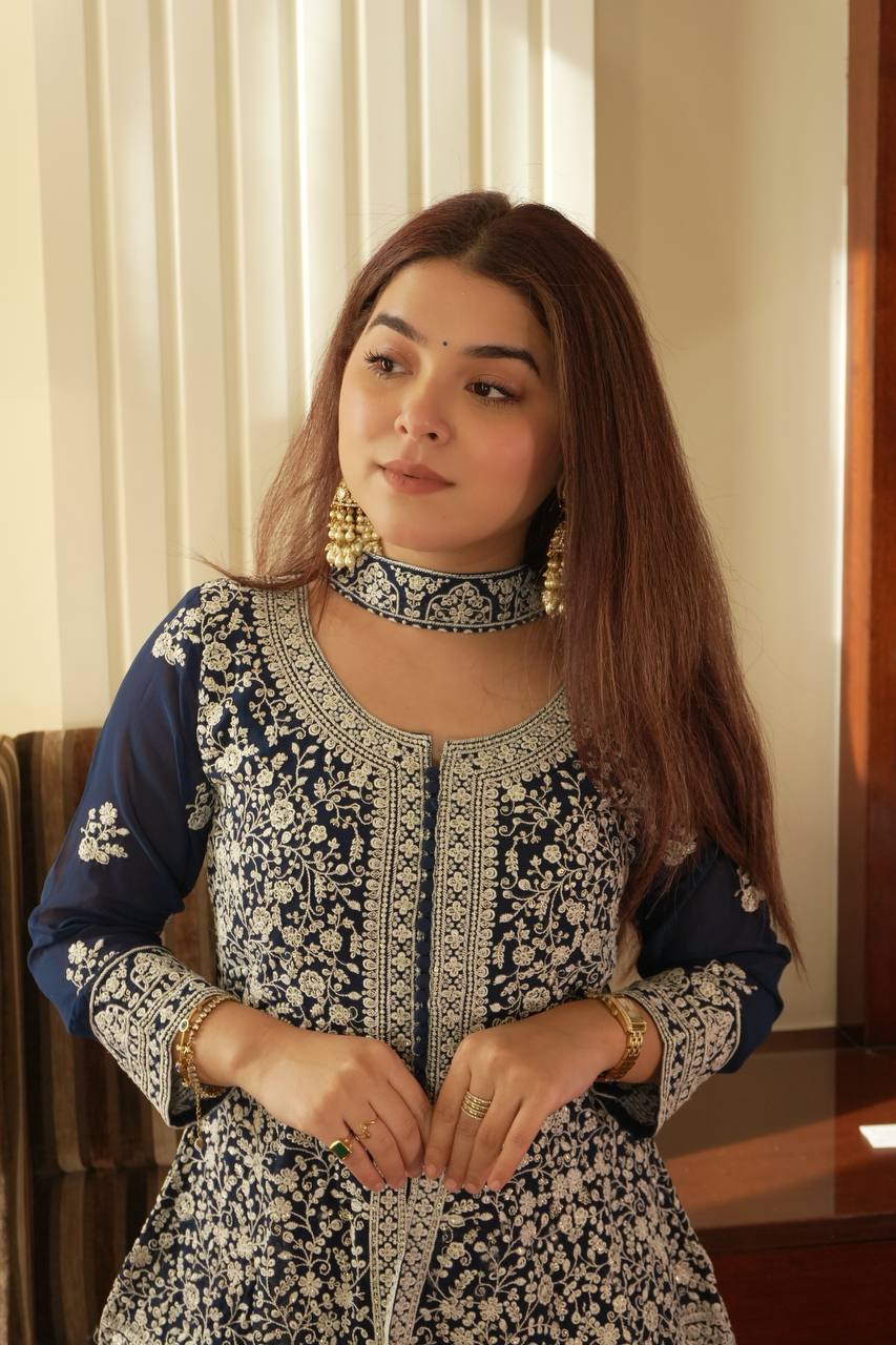 Based on this elegant navy blue embroidered ethnic outfit