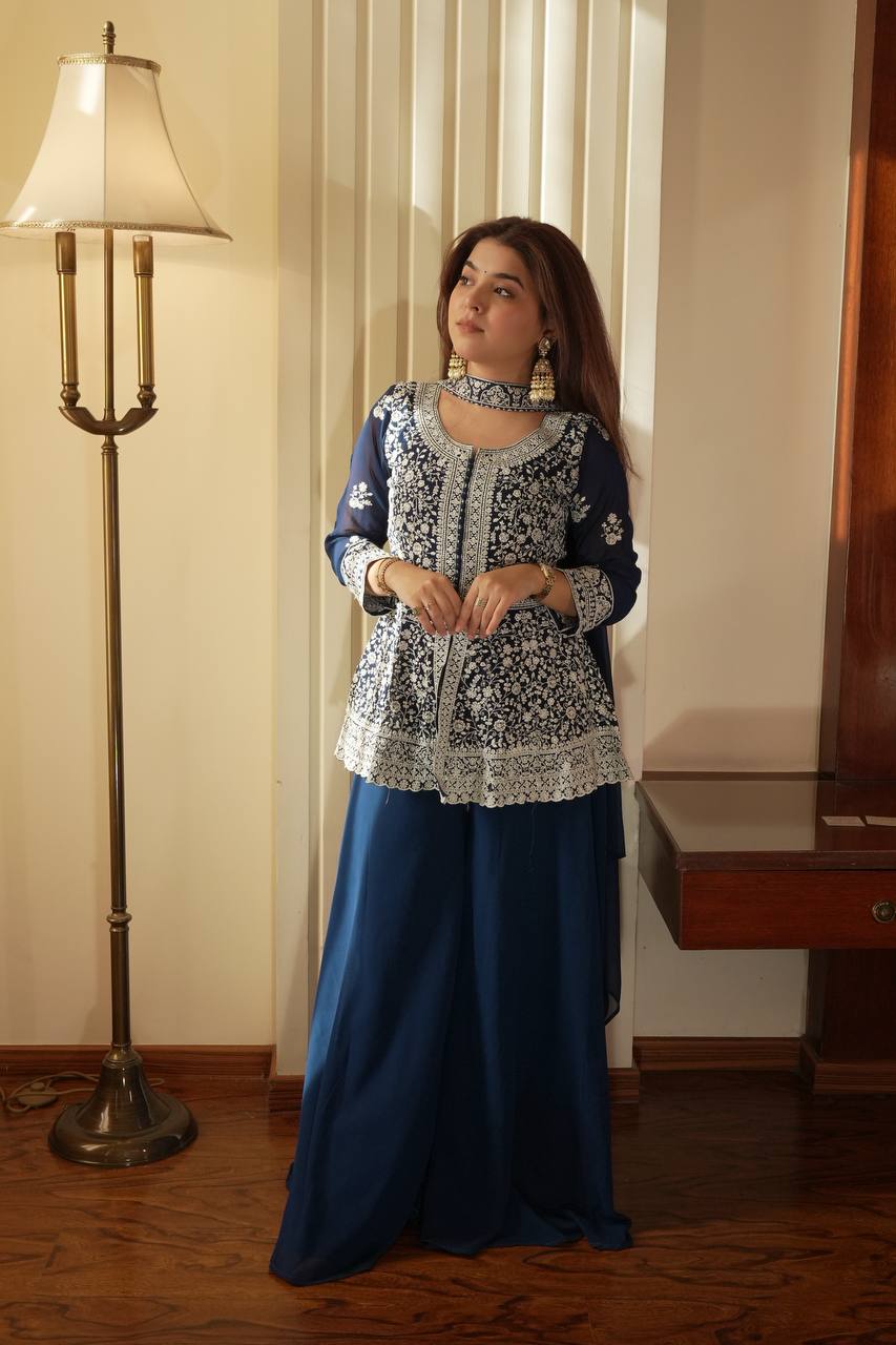 Based on this elegant navy blue embroidered ethnic outfit