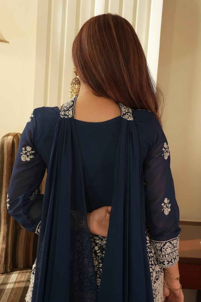 Based on this elegant navy blue embroidered ethnic outfit