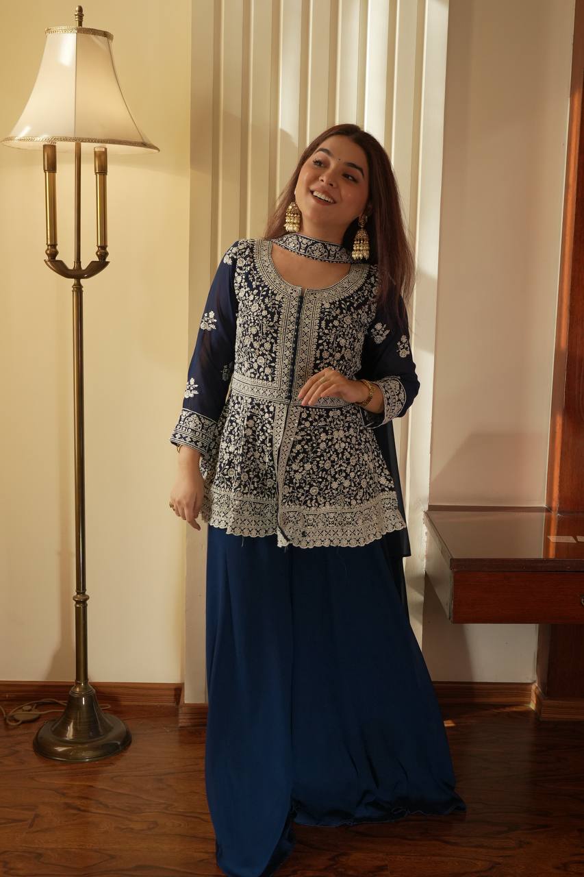 Based on this elegant navy blue embroidered ethnic outfit