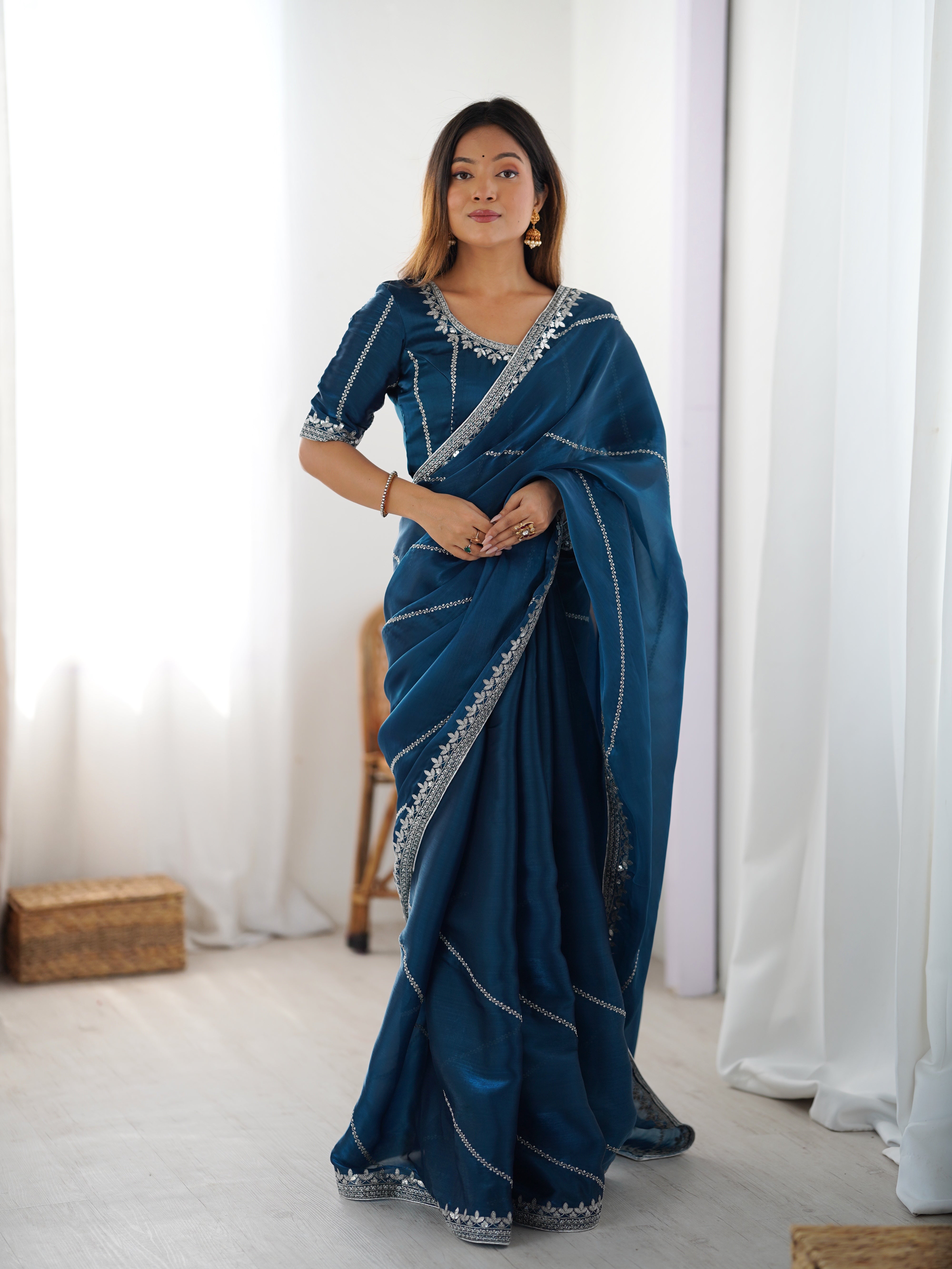Elegant Teal Saree with Silver Embellishments
