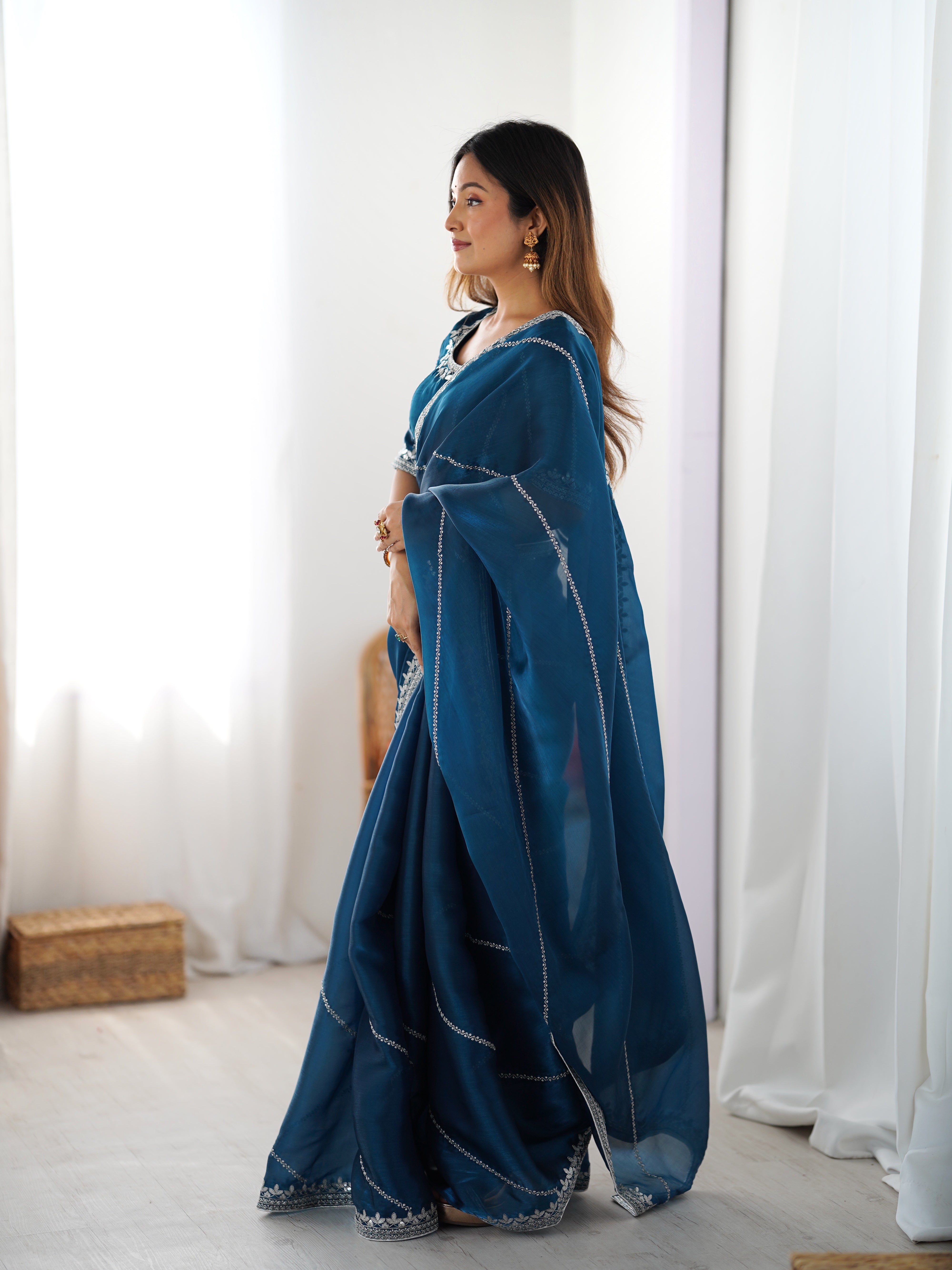 Elegant Teal Saree with Silver Embellishments