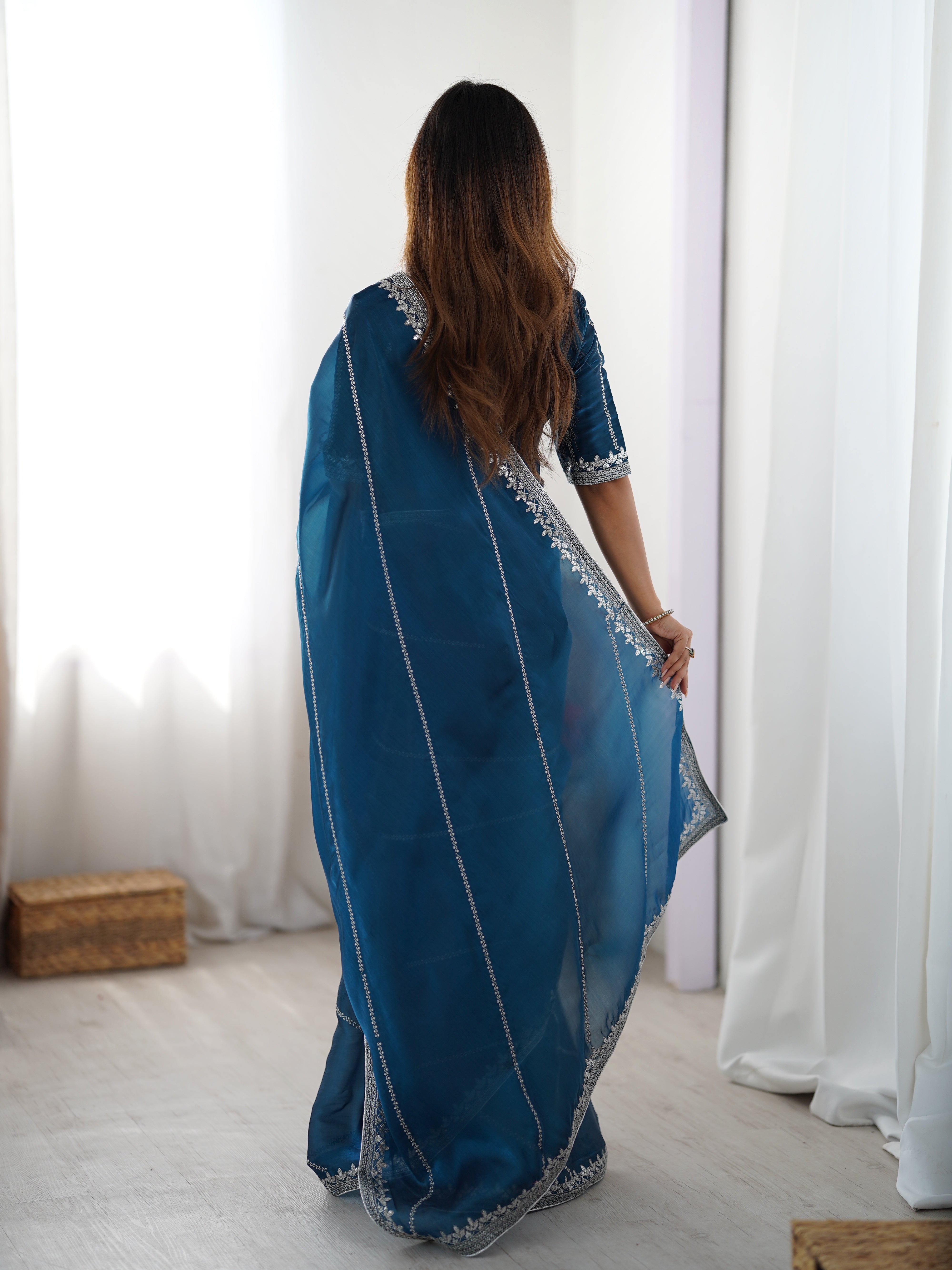 Elegant Teal Saree with Silver Embellishments