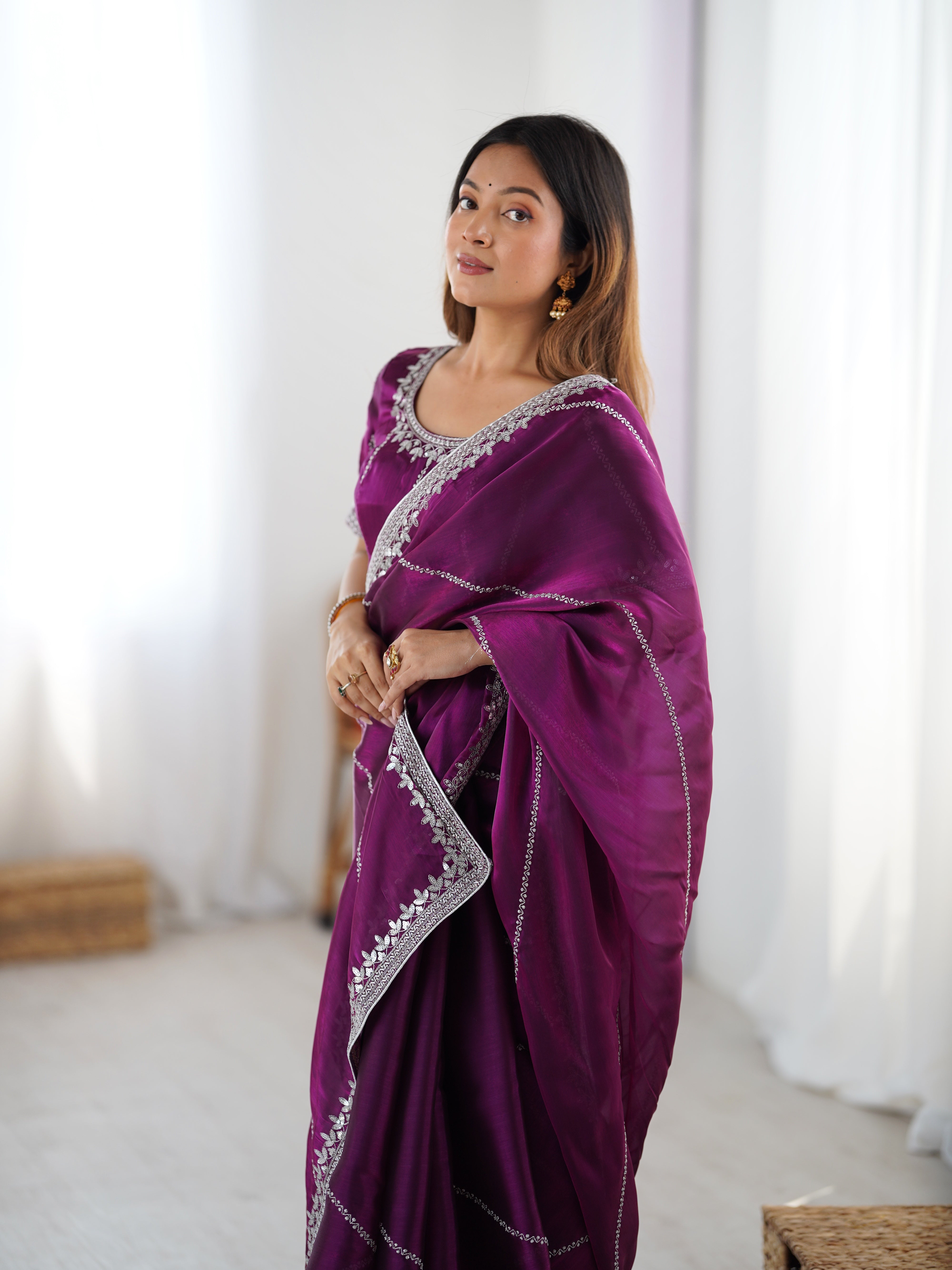 Elegant Teal Saree with Silver Embellishments