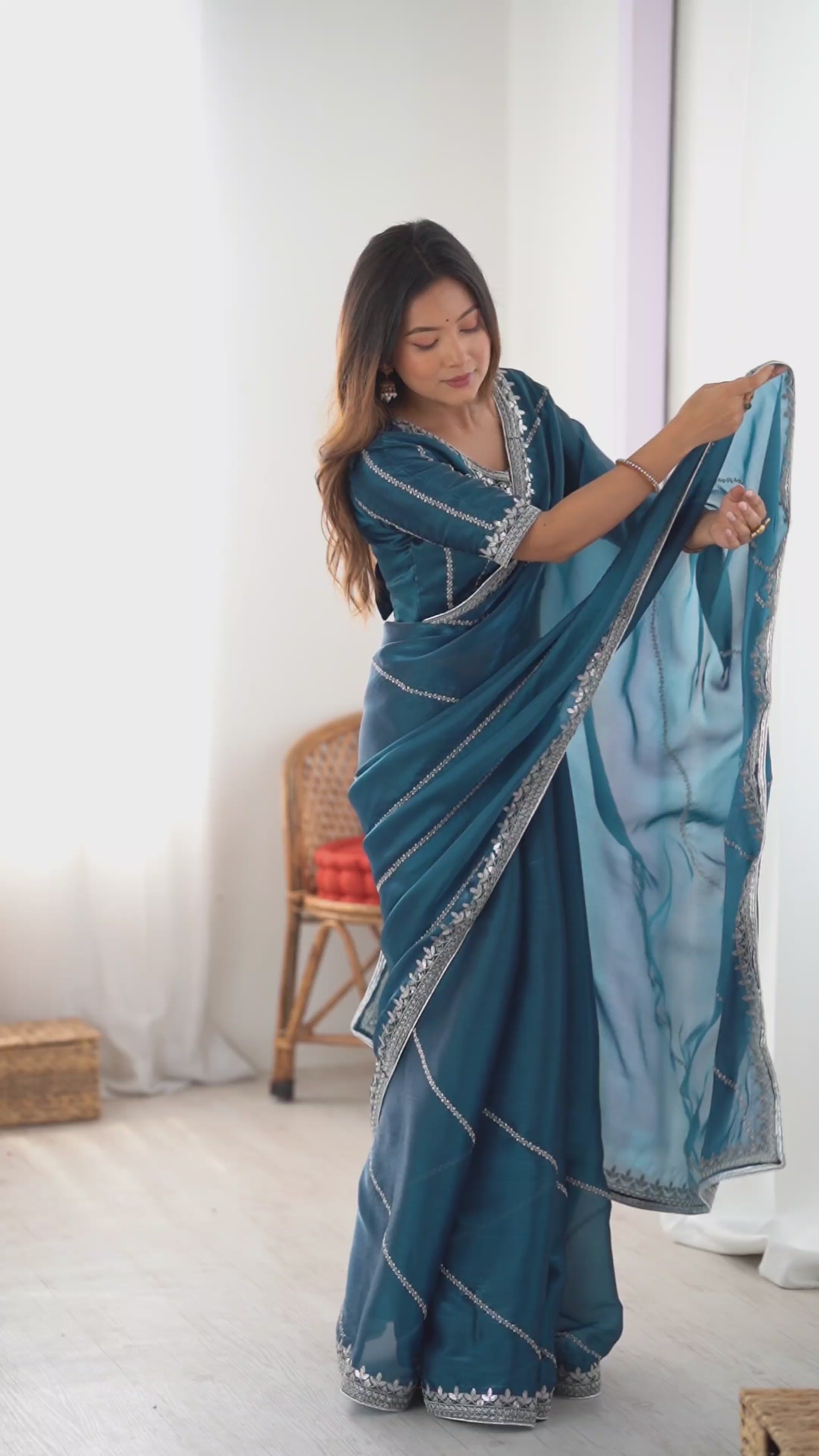 Elegant Teal Saree with Silver Embellishments